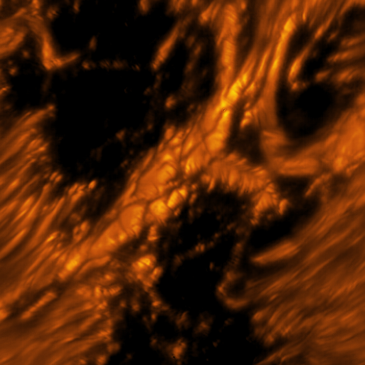 A light bridge is seen crossing a sunspot’s umbra from one end of the penumbra to the other. Light bridges are believed to be the signature of the start of a decaying sunspot, which will eventually break apart. Light bridges are very complex, taking different forms and phases. It is unknown how deep these structures form. This image shows one example of a light bridge in remarkable detail. Umbra: Dark, central region of a sunspot where the magnetic field is strongest. Penumbra: The brighter, surrounding region of a sunspot’s umbra characterized by bright filamentary structures.